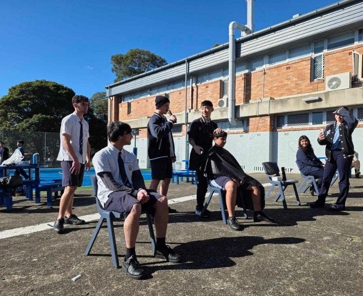 An image of students shaving their head for the Worlds Greatest Shave.